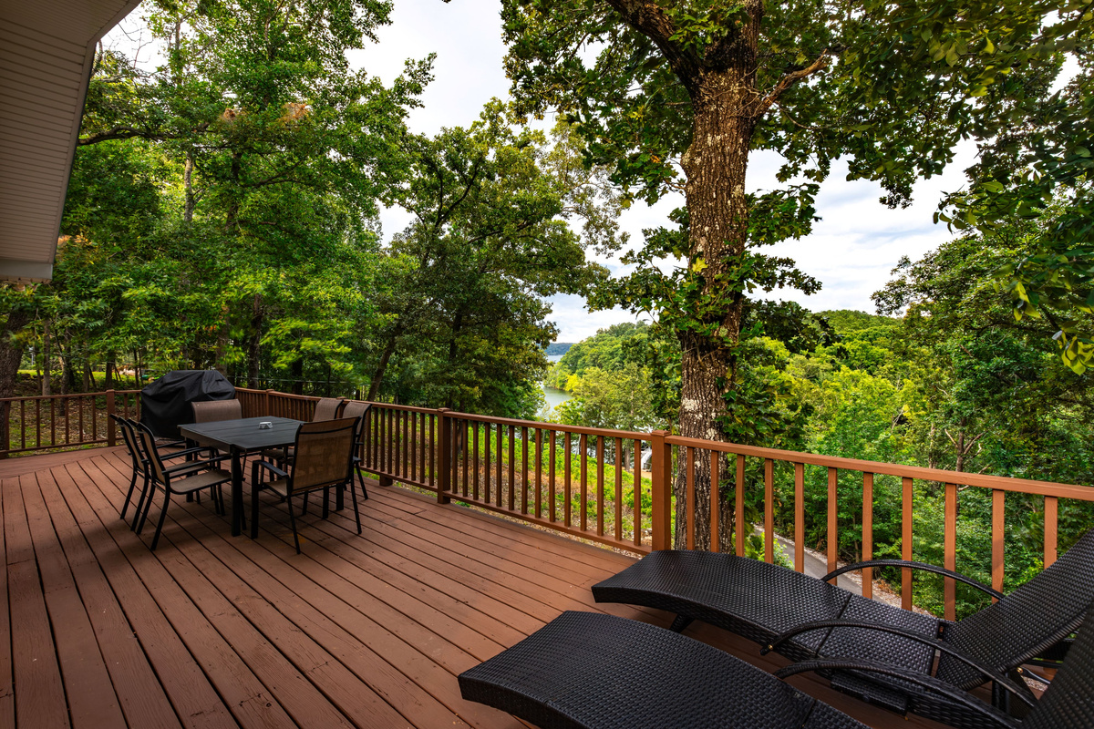 Enjoy family breakfasts, afternoon snacks, and sunset dinners on the spacious deck overlooking the trees and lake.