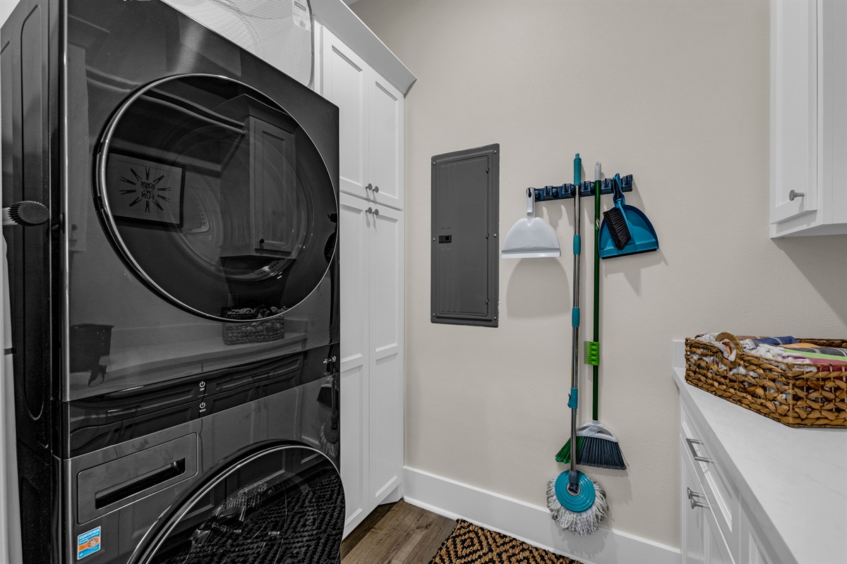 Costa Cristal Laundry: This laundry room elevates a daily chore into a pampering experience, with high-end appliances, quartz countertops, and elegant finishes. 