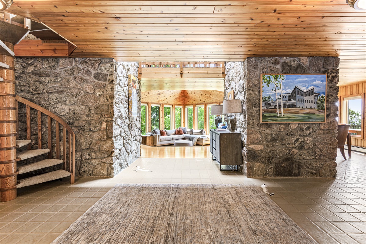 The entryway welcomes you to Three Points Lodge! Wonder into the living room with floor to ceiling windows framing Lake Superior and showing off all it's beauty. 