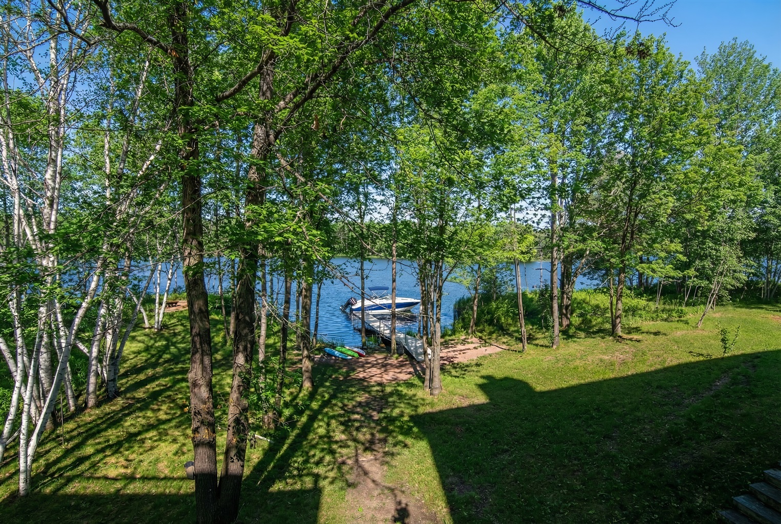 Bring your boat to this lakefront paradise on Pine Lake!
