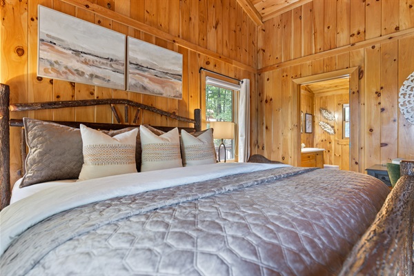 Retreat to the main-level master suite with a private ensuite bath and a quiet space to unwind or work when needed.