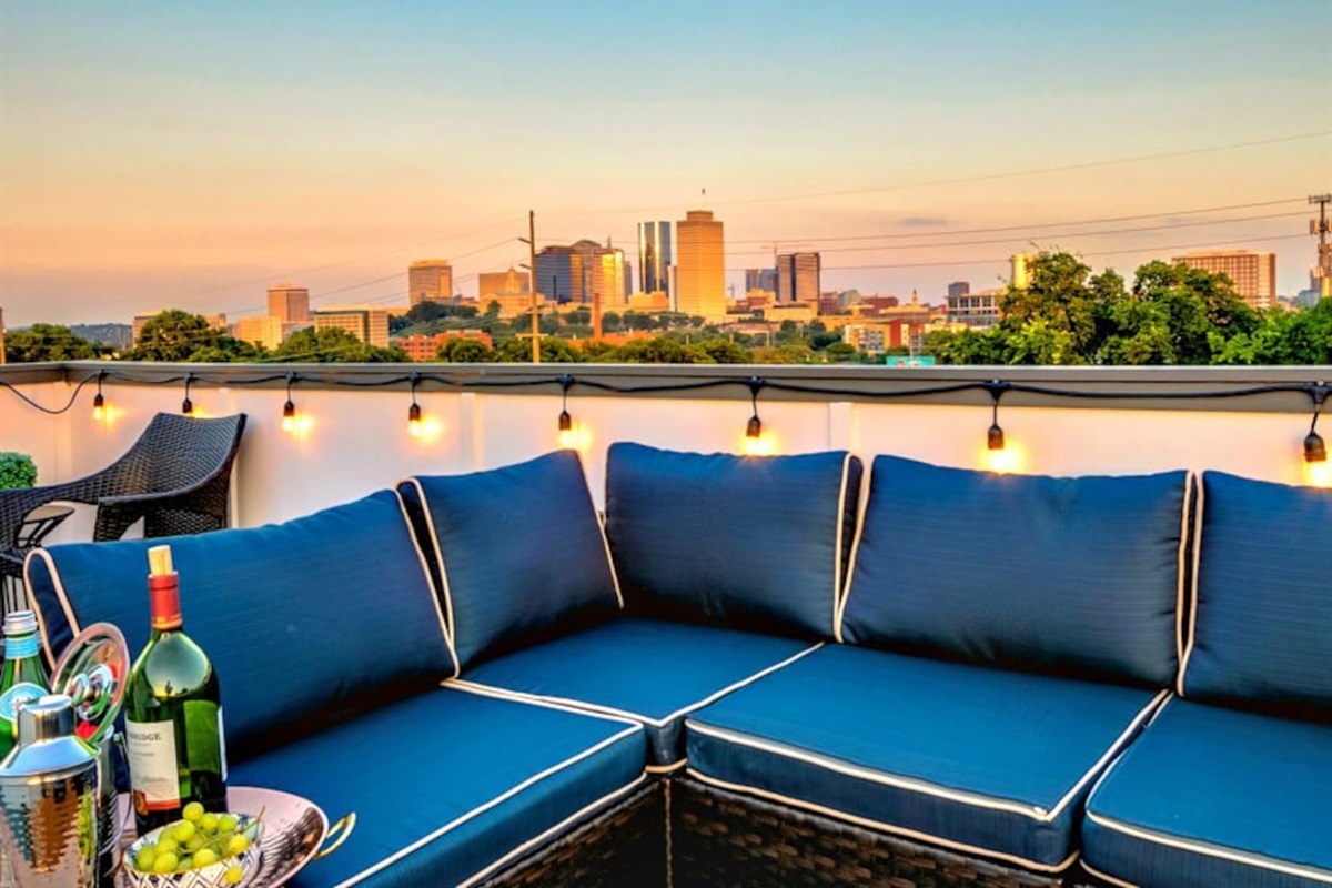 - Unwind on the spacious rooftop sectional while soaking in the city skyline at sunset - Twinkling string lights and plush seating create the perfect evening ambiance - Enjoy a chilled bottle of wine or cocktails with an unforgettable view  