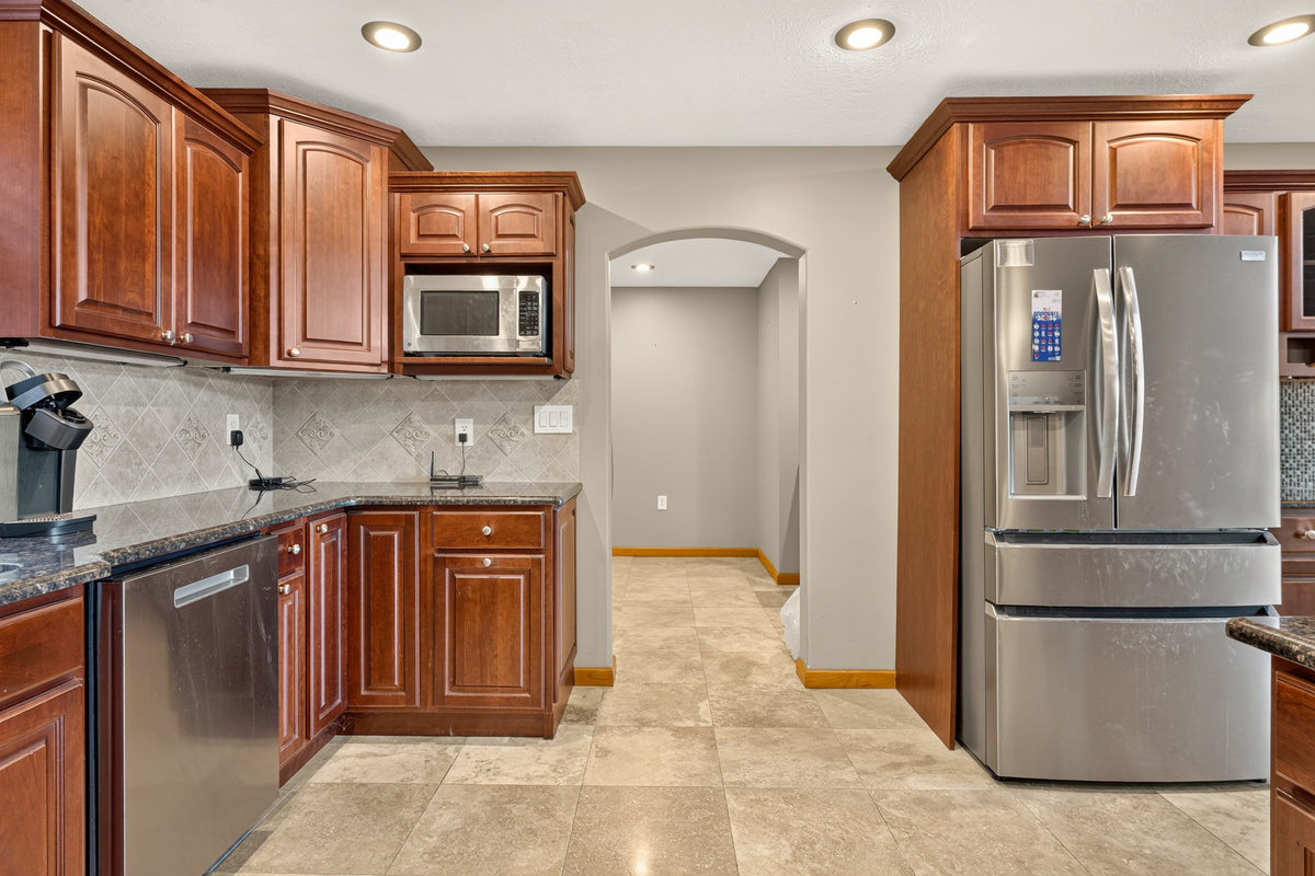 Kitchen featuring granite countertops and tiled flooring