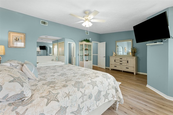 Bedroom #2 with king bed, ceiling fan, smart TV and ensuite bathroom