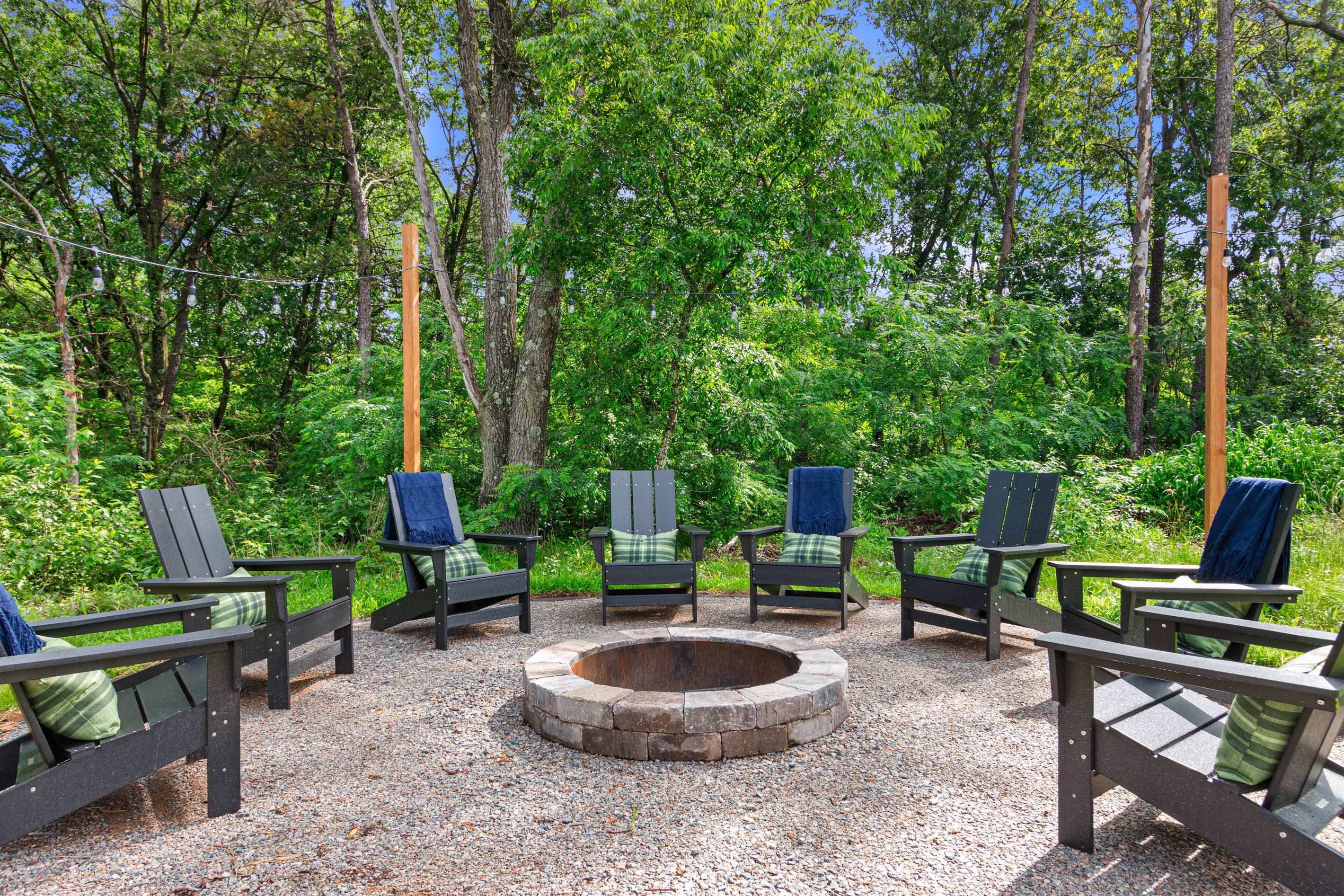 Lighted firepit area with seating for 8