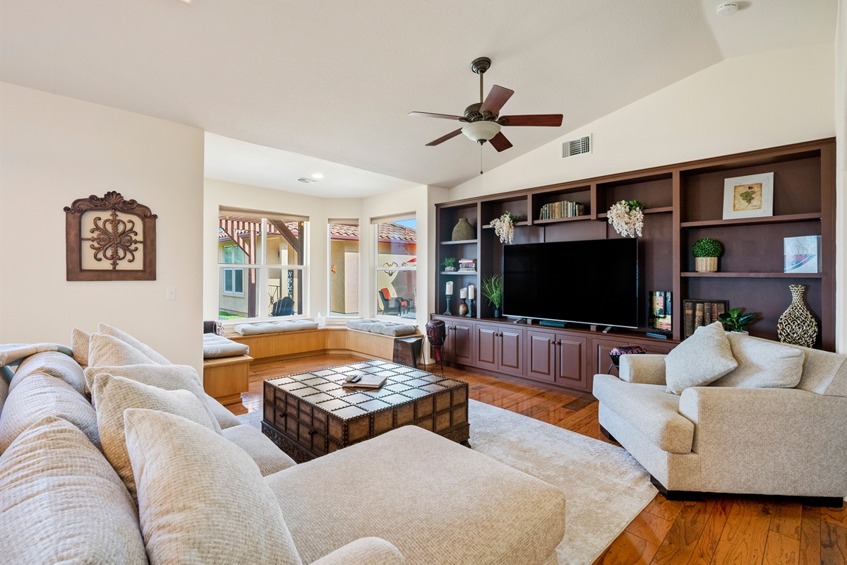 Relax in the spacious living room complete with cozy pellet stove and smart TV.