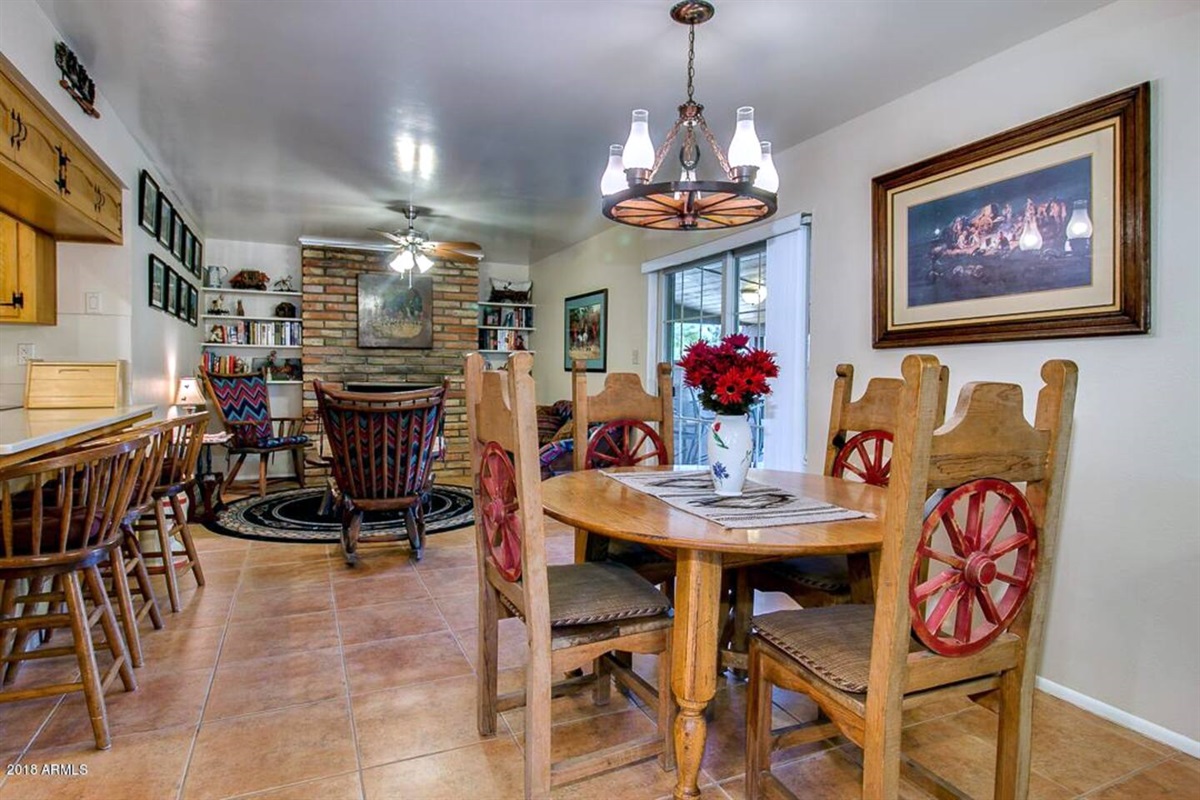 Second dining table off the dining area with more seating options at the kitchen island. 