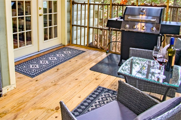 Outdoor grill station with seating and wine-ready deck — perfect for al fresco dining.