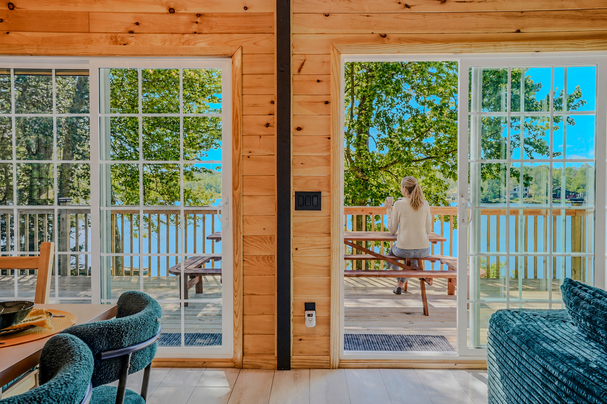  Sliding glass door framing the upper deck and Lake Carobeth — the view that greets you every morning