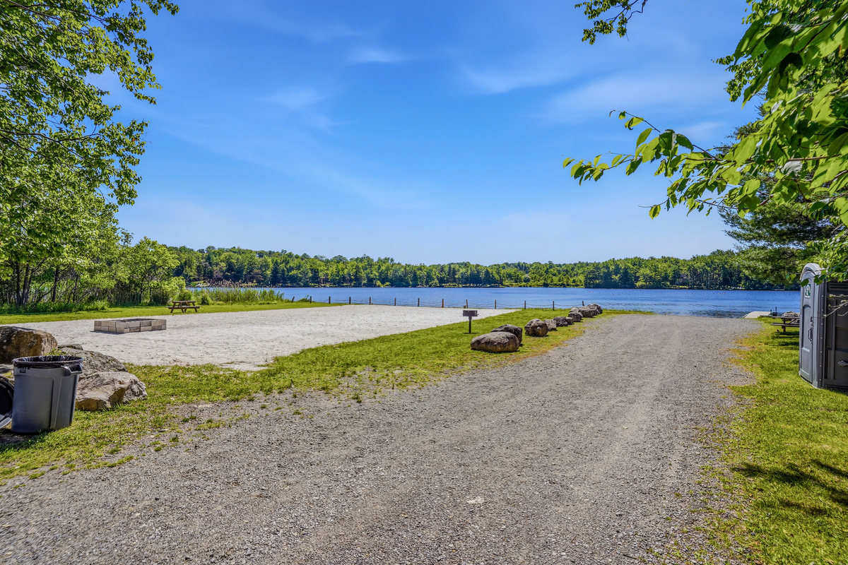 Community beach on Lake Carobeth — sandy shoreline and open water access