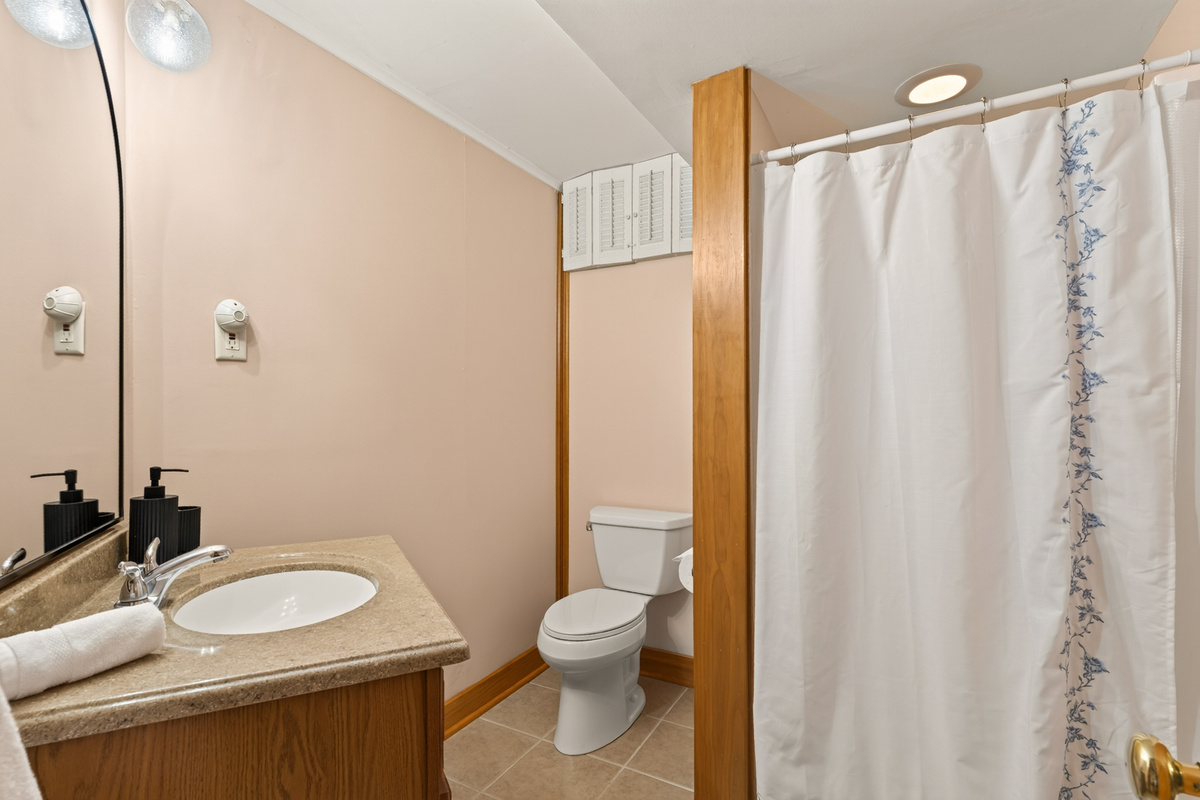Full bathroom with shower and toilet