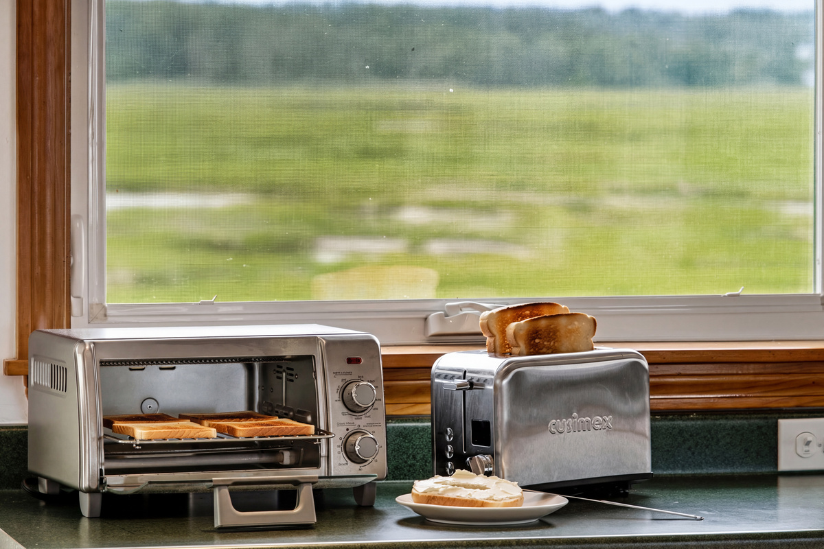 Start your morning with fresh coffee and toast while enjoying peaceful marsh views from the kitchen.