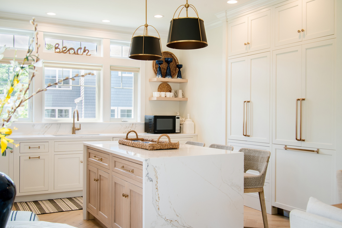 Clean coastal design meets everyday convenience in this spacious, light-filled kitchen.