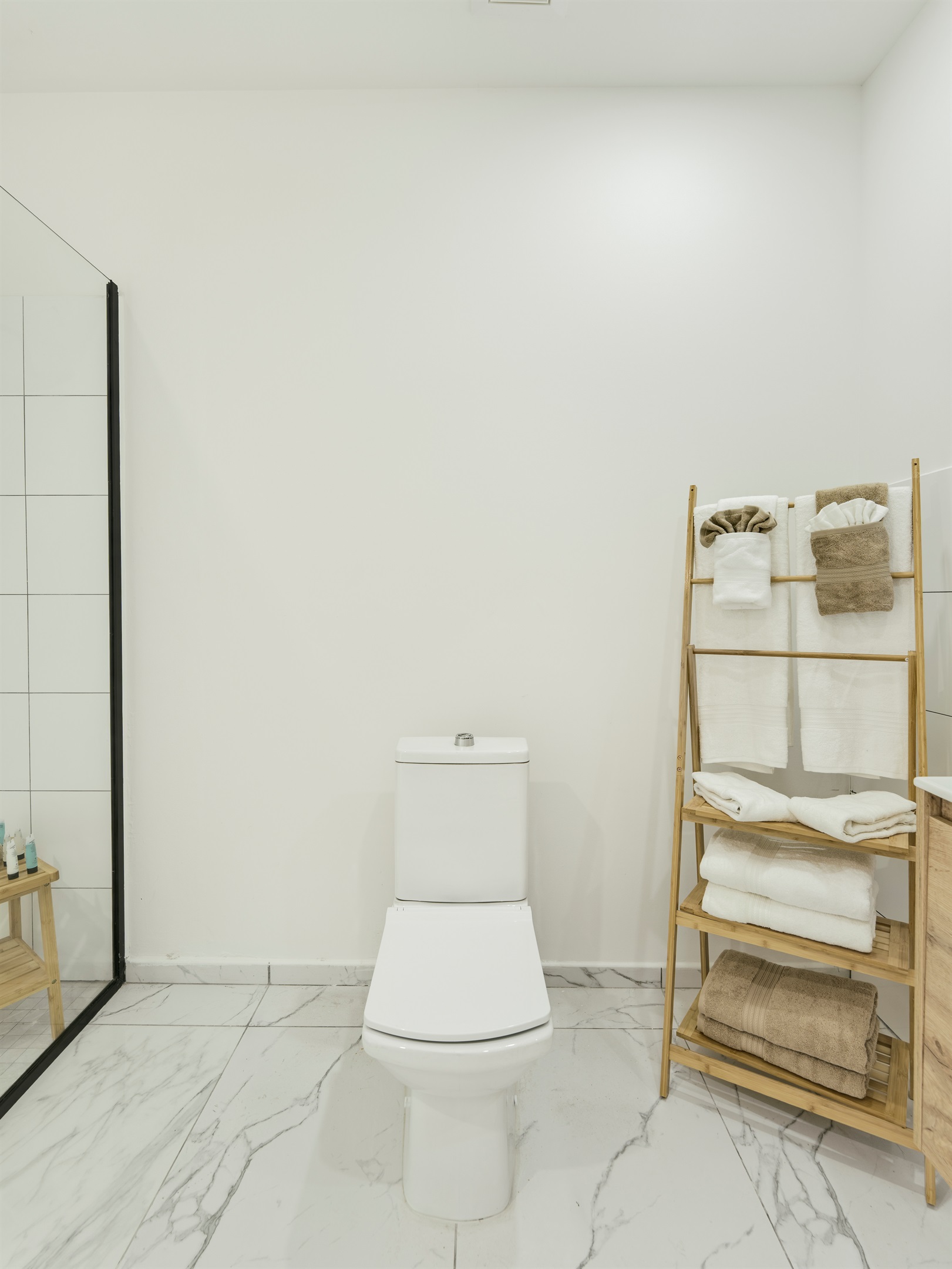 Bathroom with Modern Toilet & Woven Towel Storage Tower