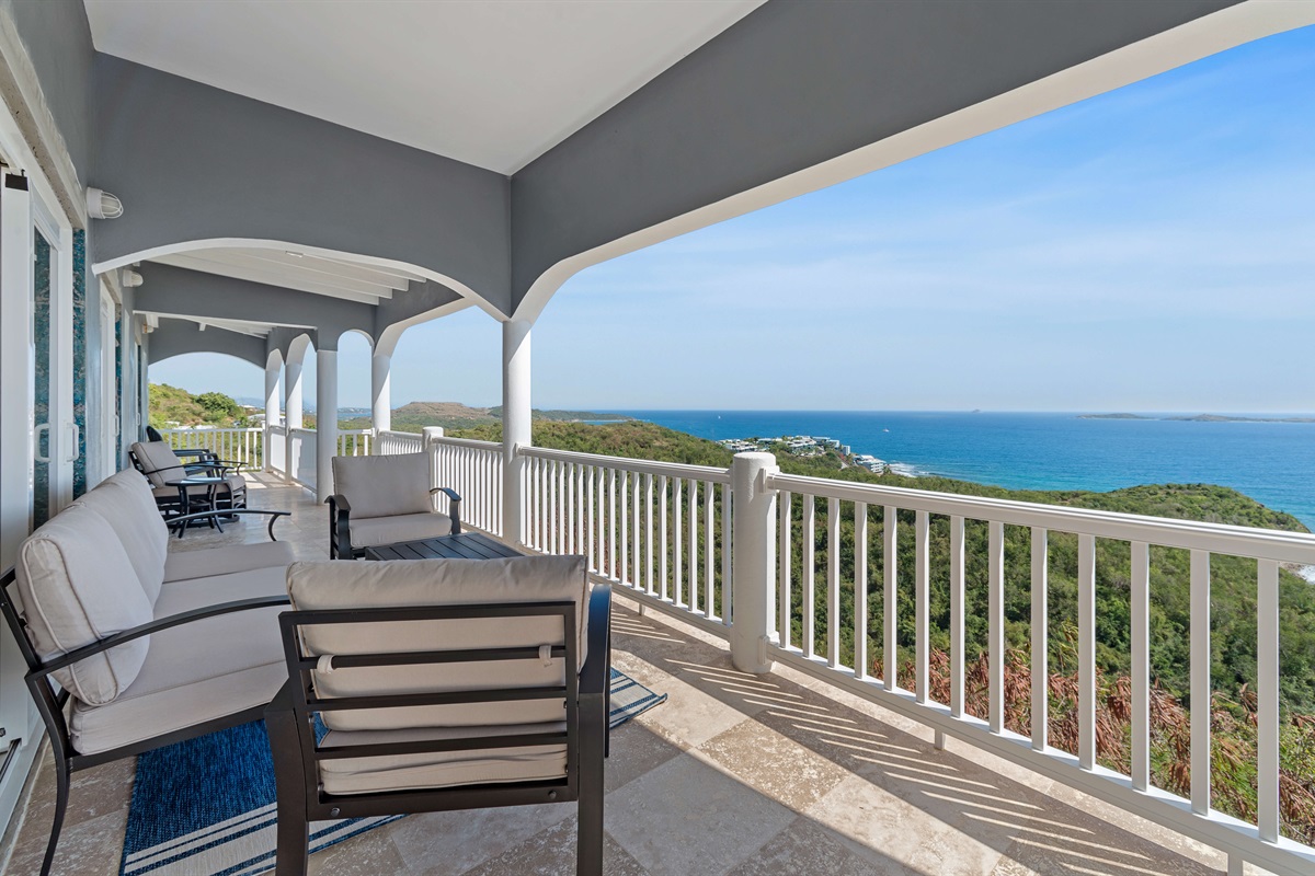 Perfect for evening chats with comfortable seating and cool island air.