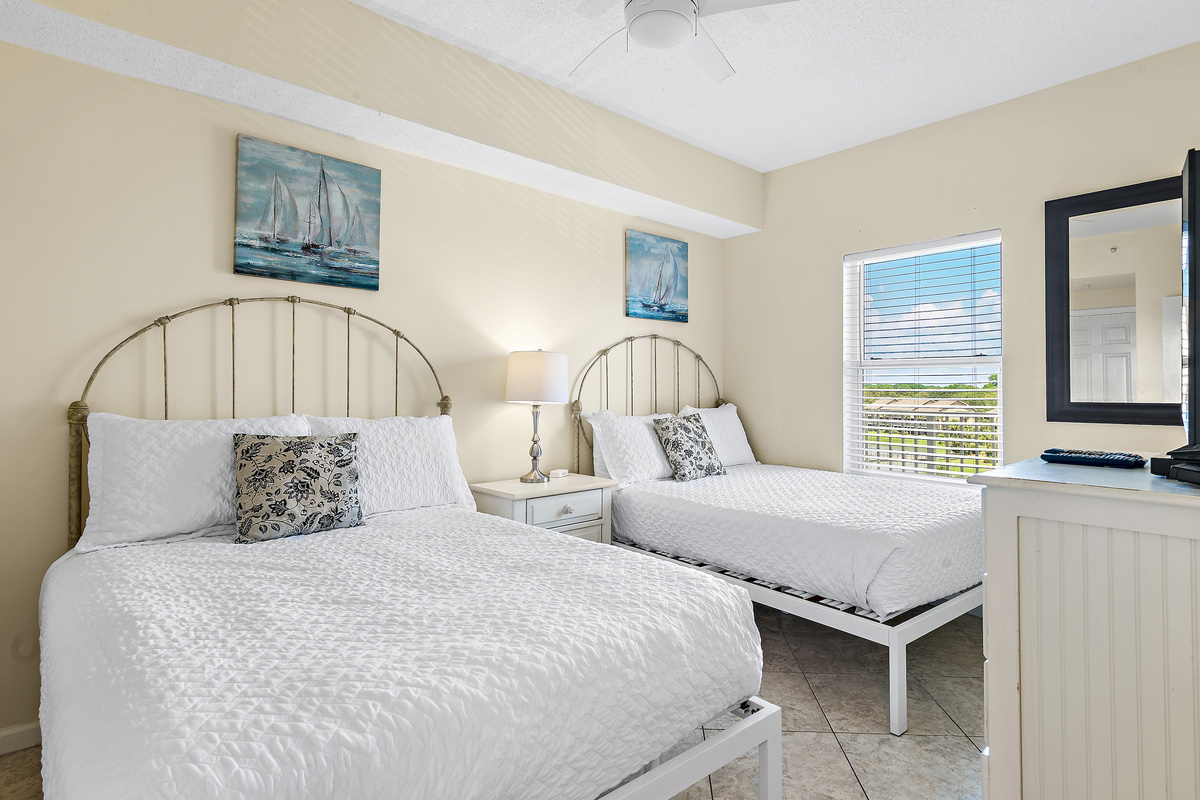 Guest Bedroom has 2 QUEEN BEDS, Smart TV, attached closet, and attached bathroom with shower/tub combo