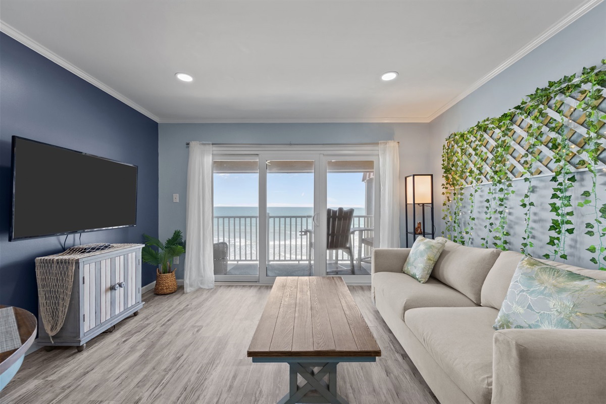 Light-filled living space with direct balcony access and ocean views just steps away
