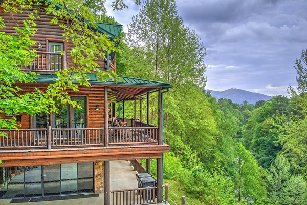 Enter via outside stairs to the 2nd level, with a Mountain View  in the distance and the Oconaluftee River directly below.