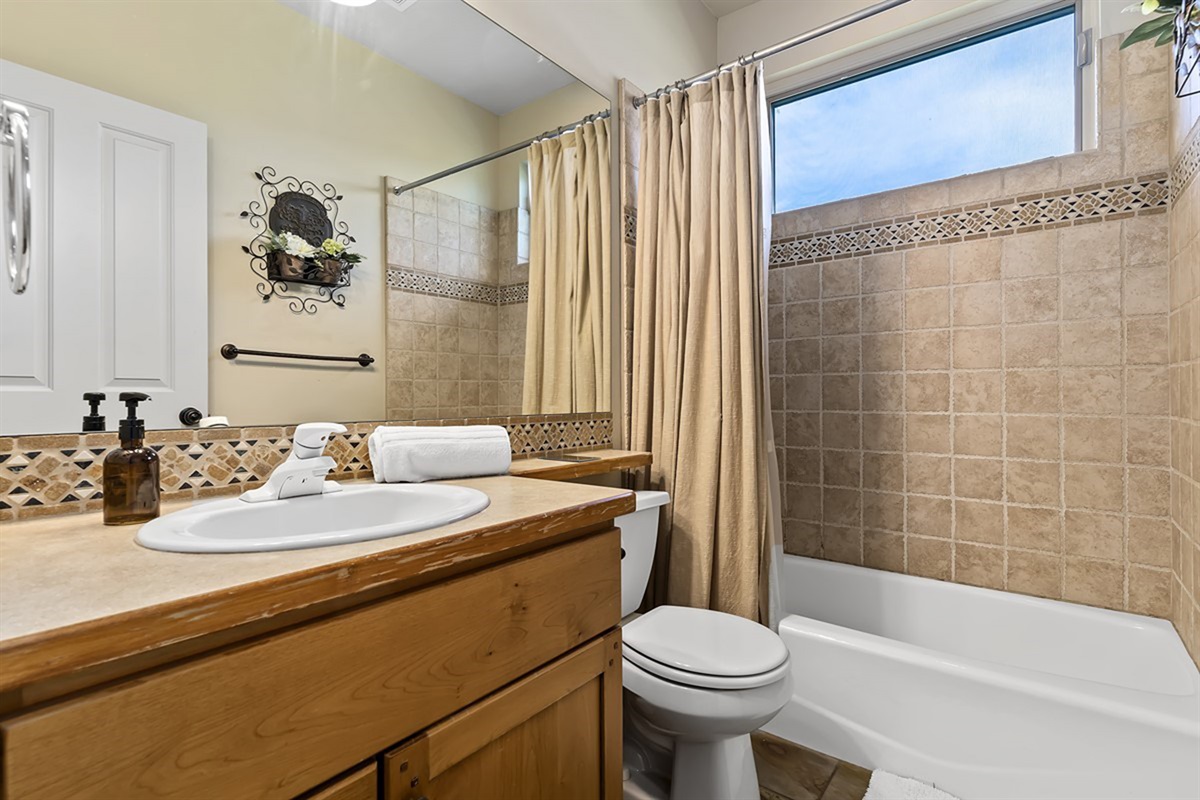 Full bathroom with tub/shower combo for convenience. We provide all the bath essentials.