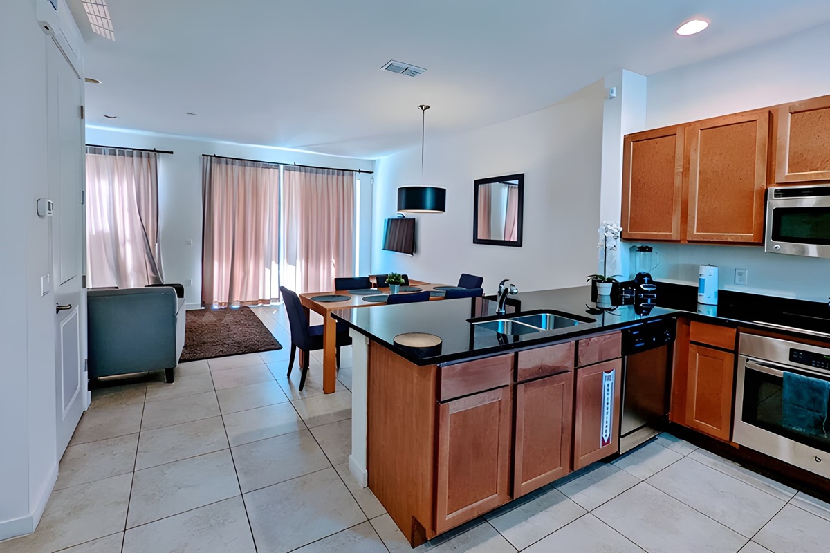 The open floor plan integrates the kitchen area with the dining and living area, overseeing your lanai with spa.There is plenty of room for family gatherings and entertainment!