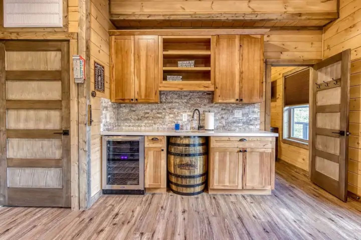 Game room bar area with a dual temp wine cooler