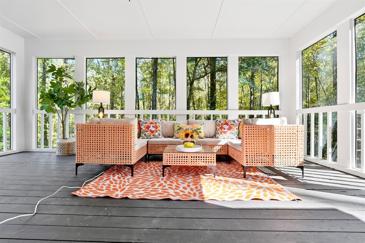 Cozy sunroom with warm orange tones, perfect for relaxing and soaking up the sunshine on bright days.