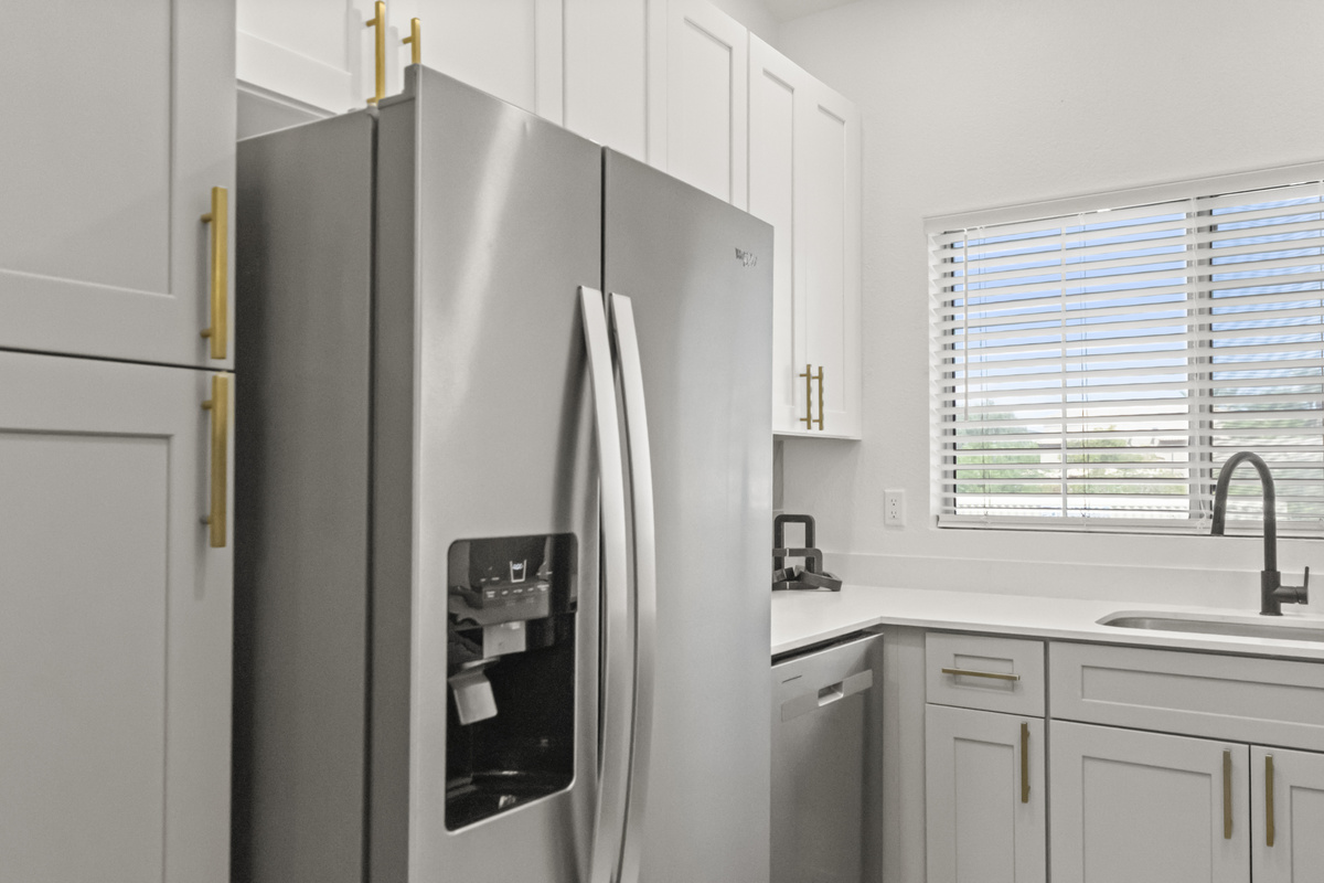 Well-appointed kitchen with a full-size refrigerator, modern appliances, and plenty of storage for longer vacation stays.
