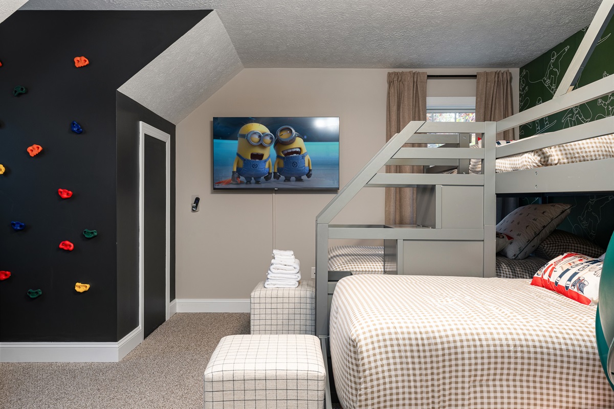 A kid-approved hideaway with a climbing wall, big-screen TV, and plenty of space to pla