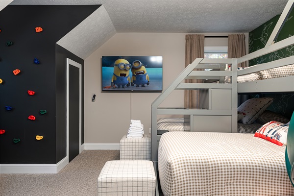 A kid-approved hideaway with a climbing wall, big-screen TV, and plenty of space to pla