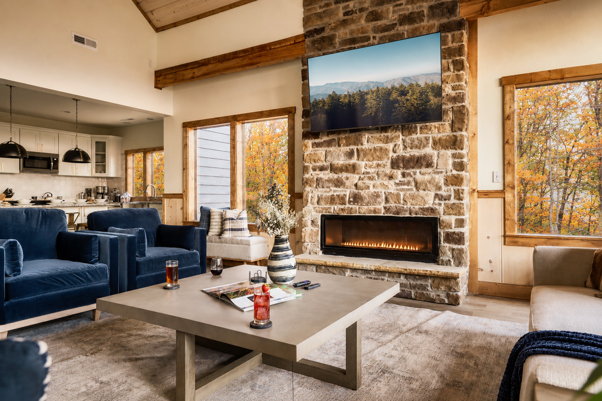 Living room features 65" TV and gas fireplace