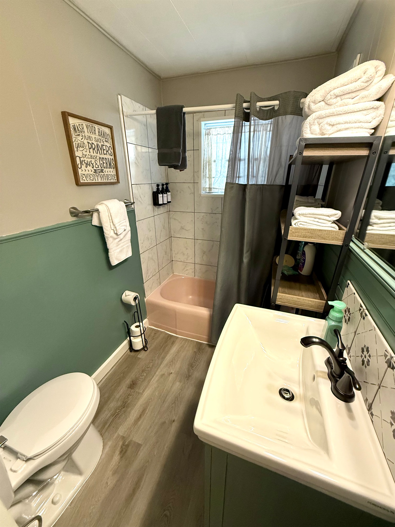 Full bath with tub/shower combo.