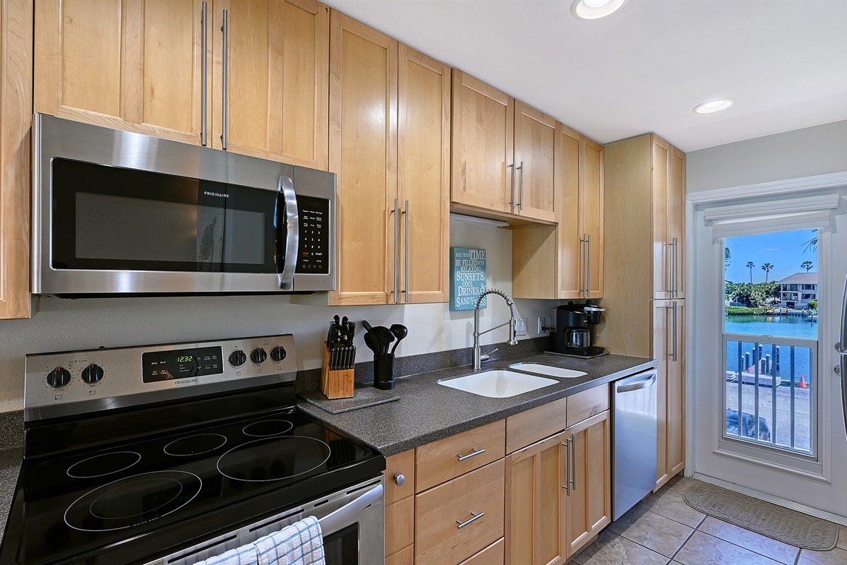 The kitchen also faces the boat docks & inlet