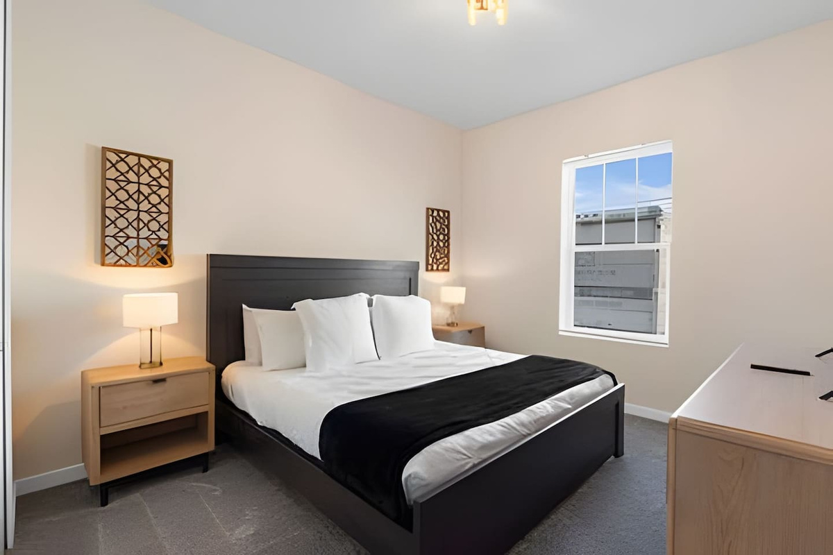 Enjoy restful nights in this bedroom, featuring plush bedding.