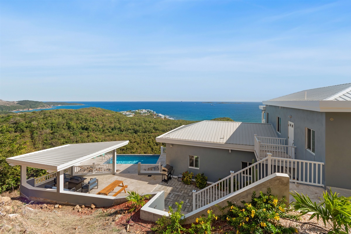Panoramic drone view highlighting the villa's privacy and location.
