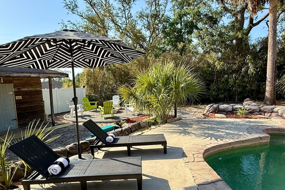 Relax in style in our dreamy backyard oasis. Whether you're soaking up the sun or enjoying a cool breeze, this serene corner is your perfect escape.

