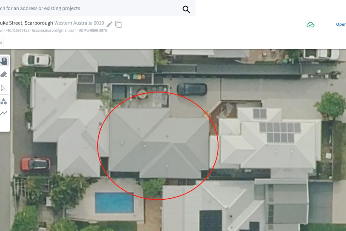 Aerial view of the home (circled in red), set on a quiet residential street