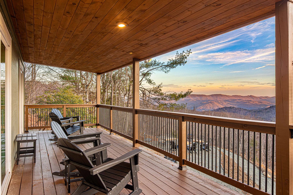 Off the "Duck Room" is a covered porch seating provides shade and comfort, creating an ideal spot to enjoy the scenery in any weather.