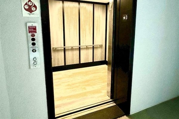 Take the elevator to the 5th floor. The parking lot is the same elevation as the 3rd floor.