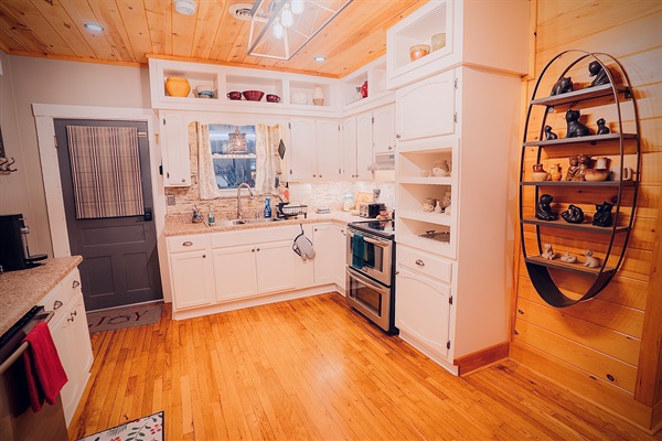 Fully stocked, family-friendly kitchen with modern appliances, plenty of counter space, and everything you need to cook meals or snacks together after a day of exploring Pigeon Forge.