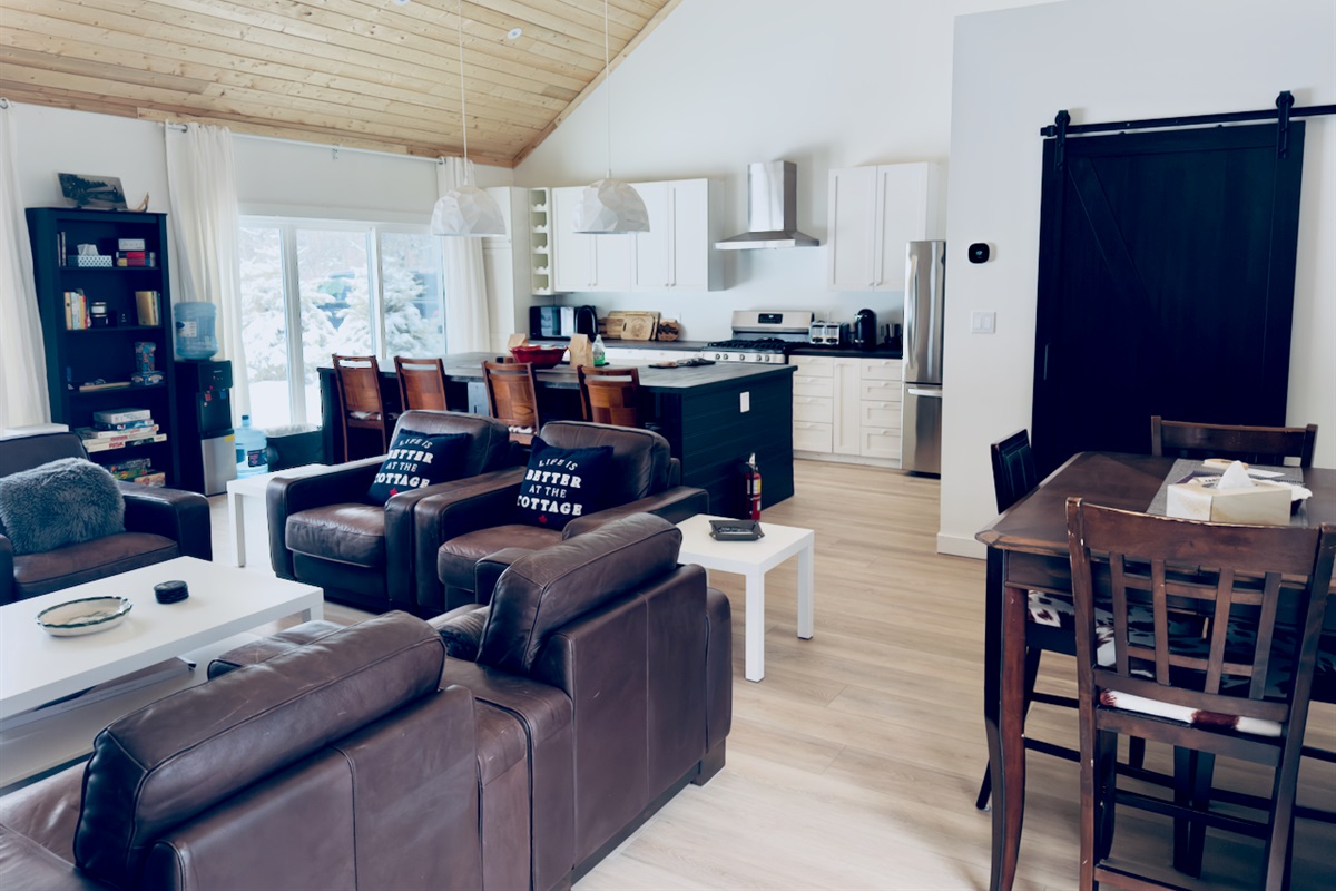 Open layout connecting the living room, dining area, and kitchen