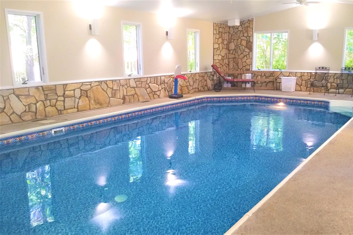 Heated indoor private swimming pool 16 x 32 feet. 3ft in shallow end, 5ft deep end.  In April 2025  - new pool liner! The pool bottom looks like it is moving when there are waves in the water.