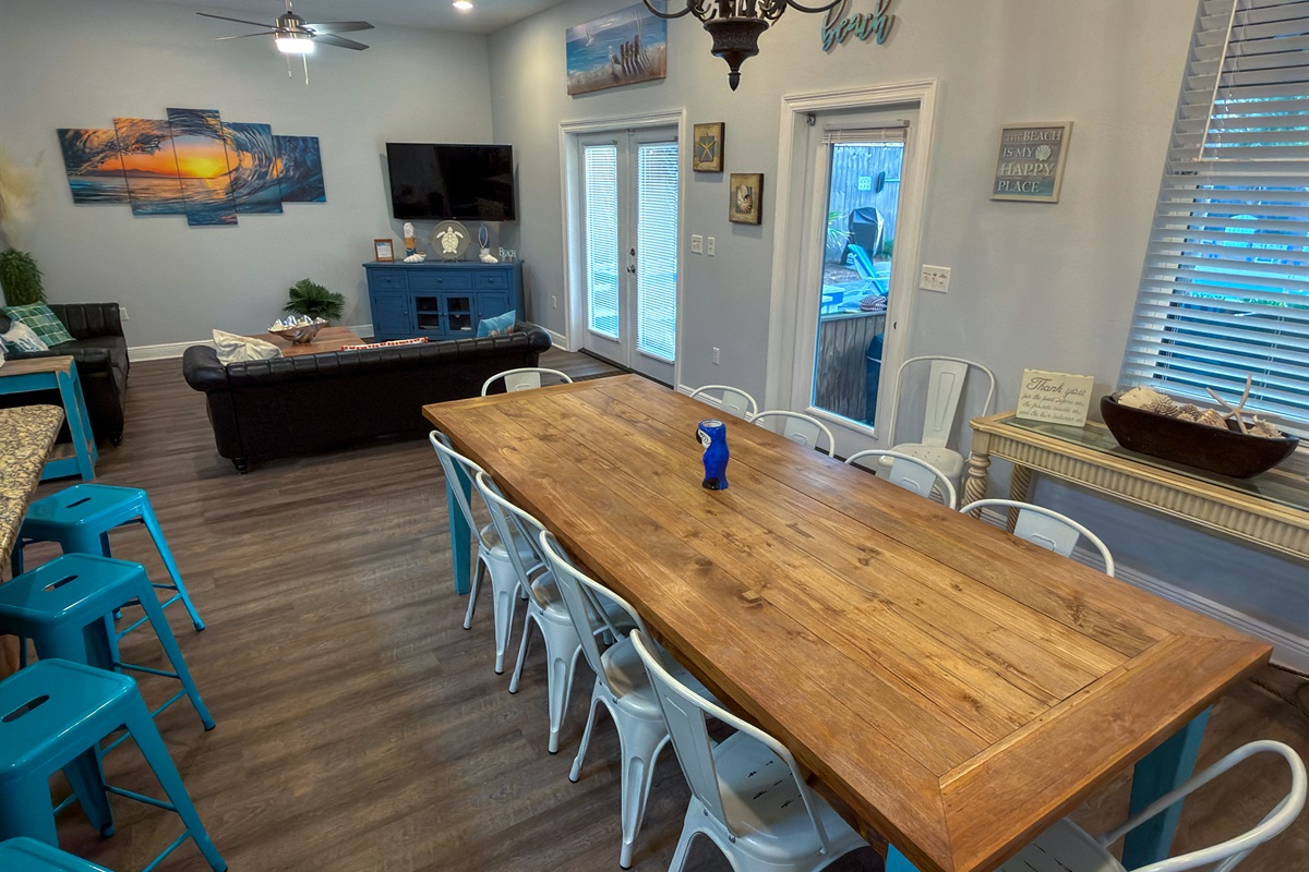 Gather, dine, and unwind with a layout that connects seamlessly to the screened-in patio and tropical poolside retreat.