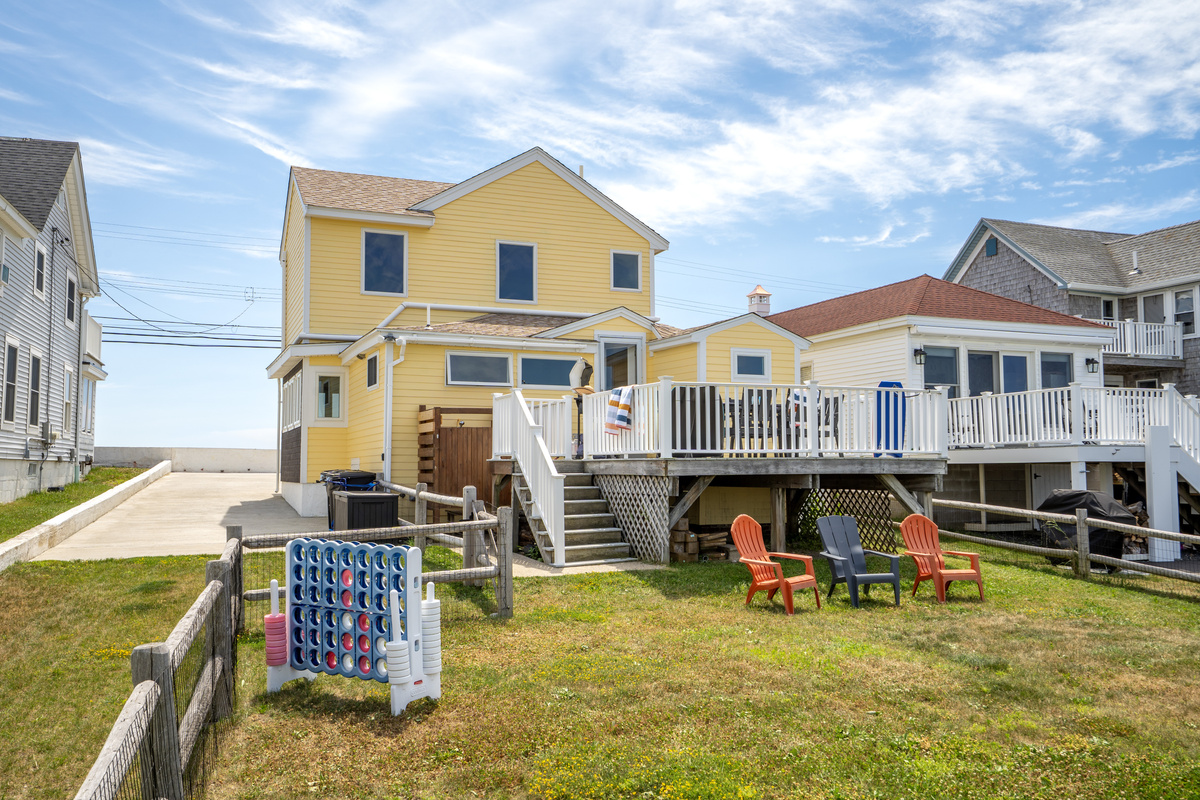 Our backyard offers everything you need for outdoor living, including a dining area, propane grill, outdoor shower, and open space!