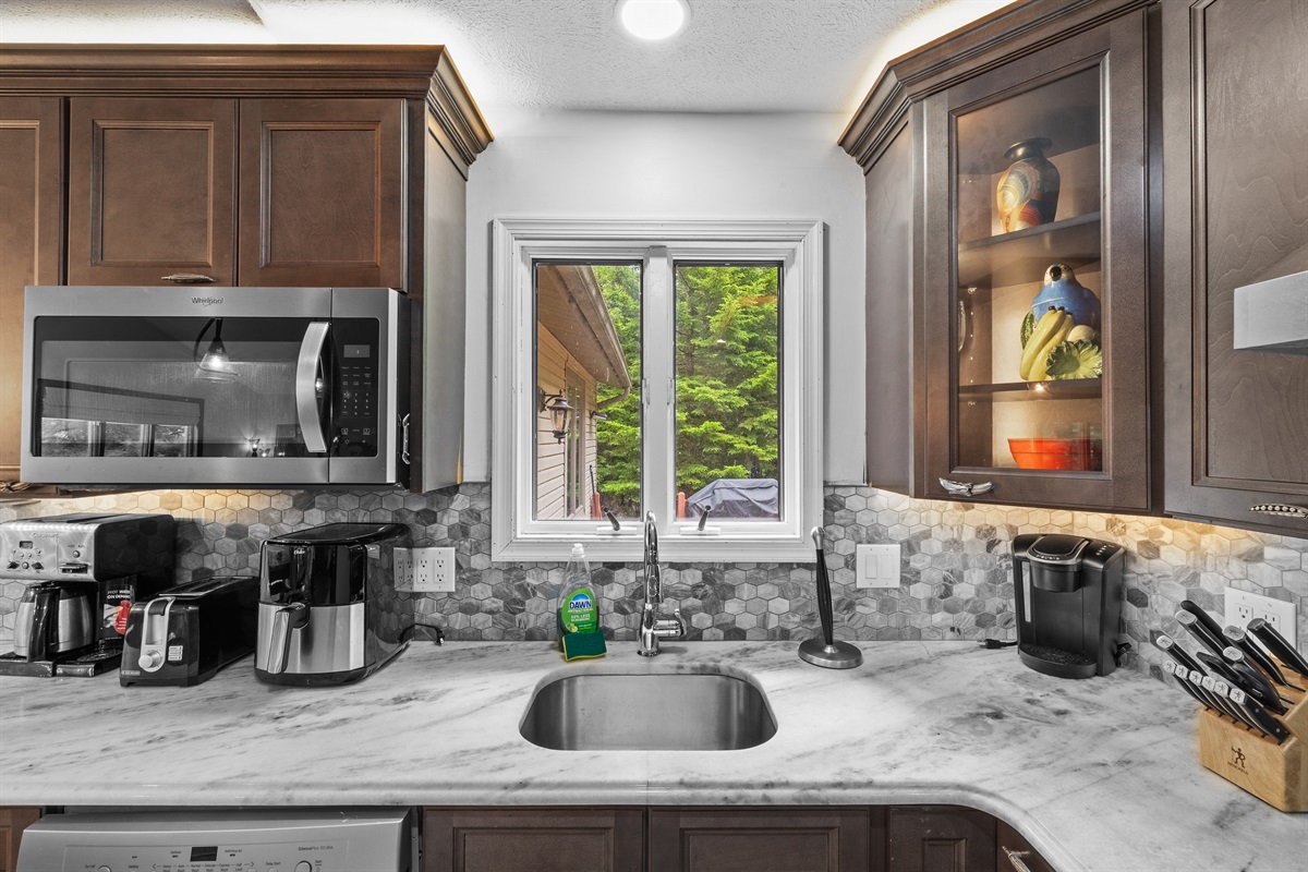 Cook with ease in this modern kitchen—includes full appliances and island counter