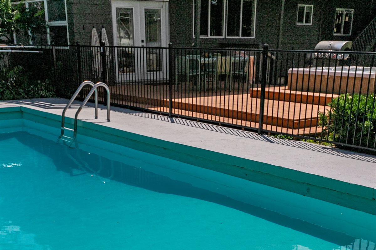 The pool is secured with a safety gate, giving you peace of mind while still enjoying fun and relaxation by the water.
