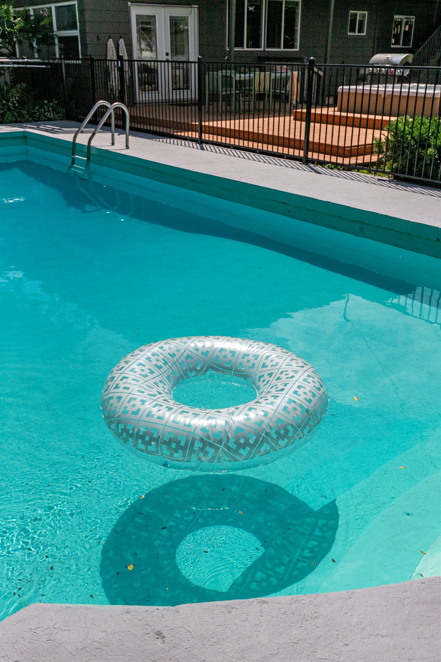 The pool is secured with a safety gate, giving you peace of mind while still enjoying fun and relaxation by the water.