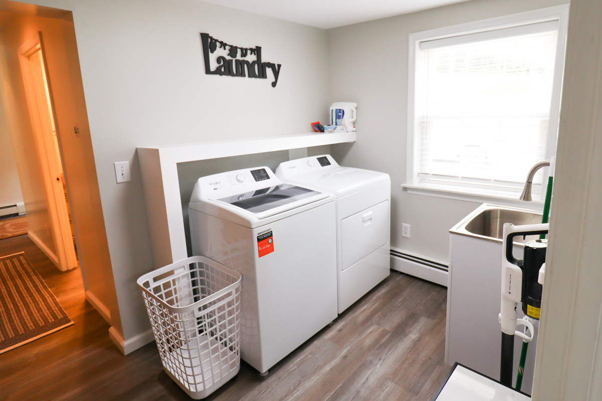 Laundry room with detergent provided