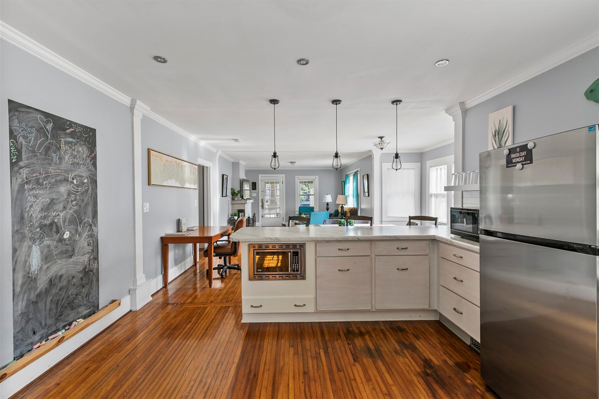 Cook, gather, and connect in a modern kitchen with stainless steel appliances and bar seating