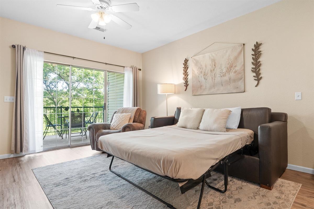 Sleeper sofa set up for extra guests, helping the condo sleep beyond the two bedrooms.
