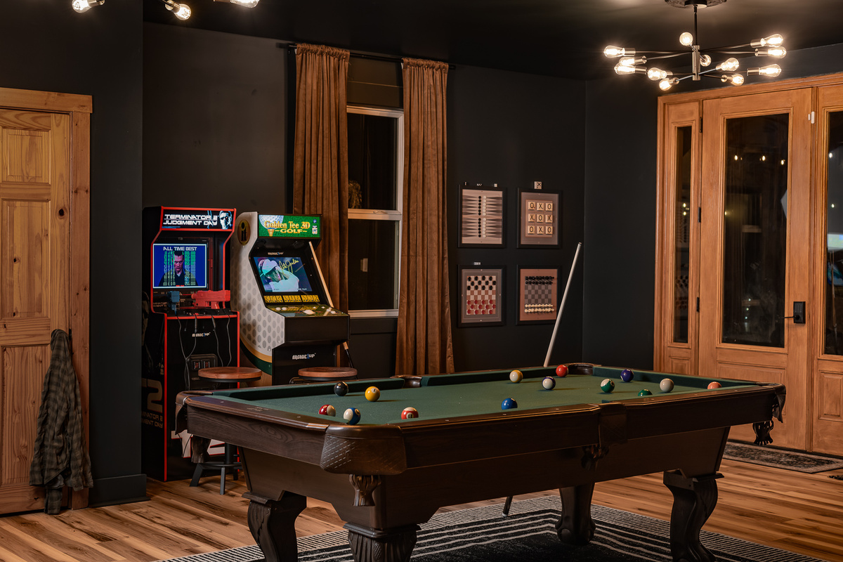 {Speakeasy Game Room} Challenge the group to pool, hit the arcade games, and settle in for a late night at your own private mountain speakeasy.
